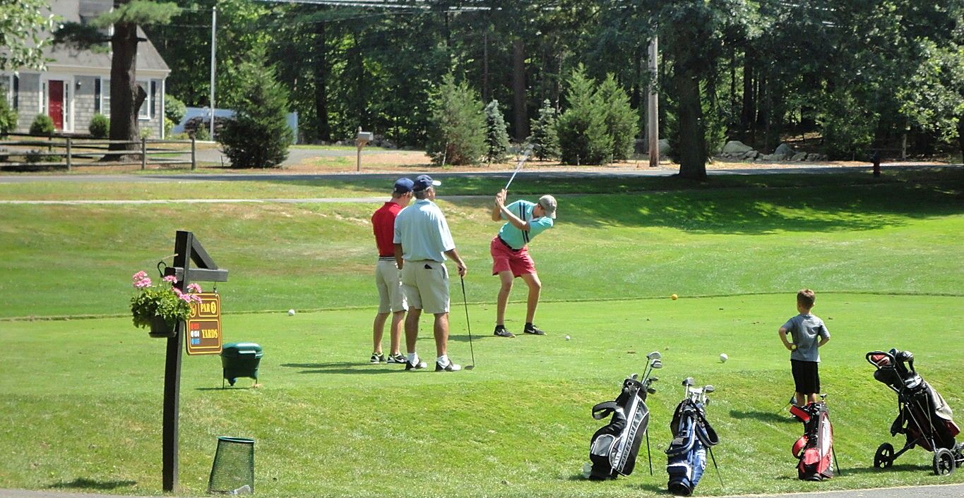 Residents on the tee at Royal Crest on a summer afternoon