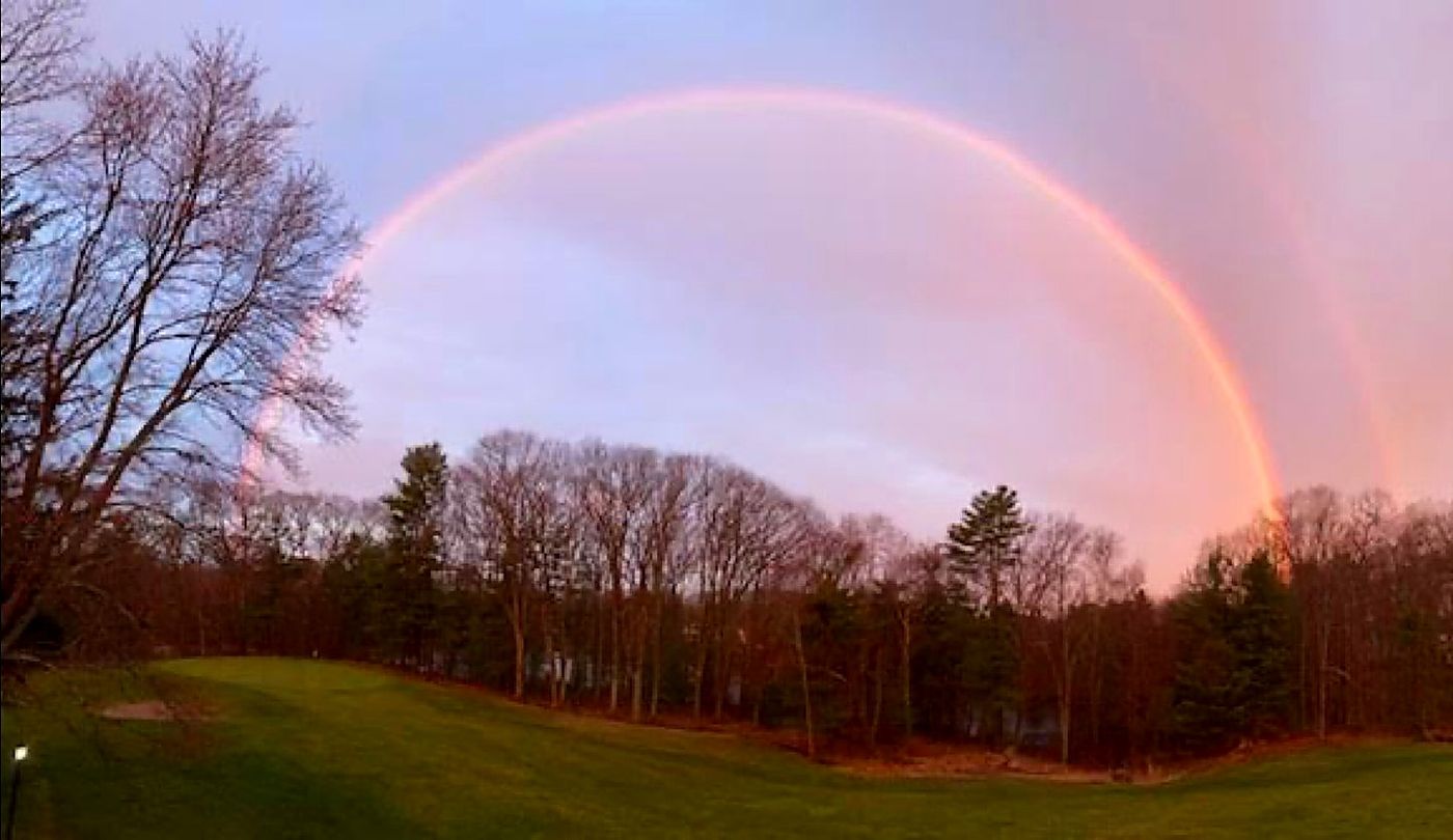 A rainbow over the Royal Crest course at dusk