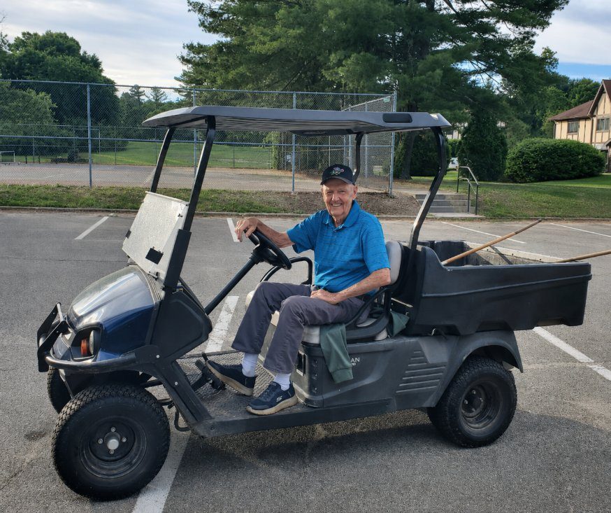 JP Jones, the Royal Crest greenskeeper, seated in his Club Car on the grounds